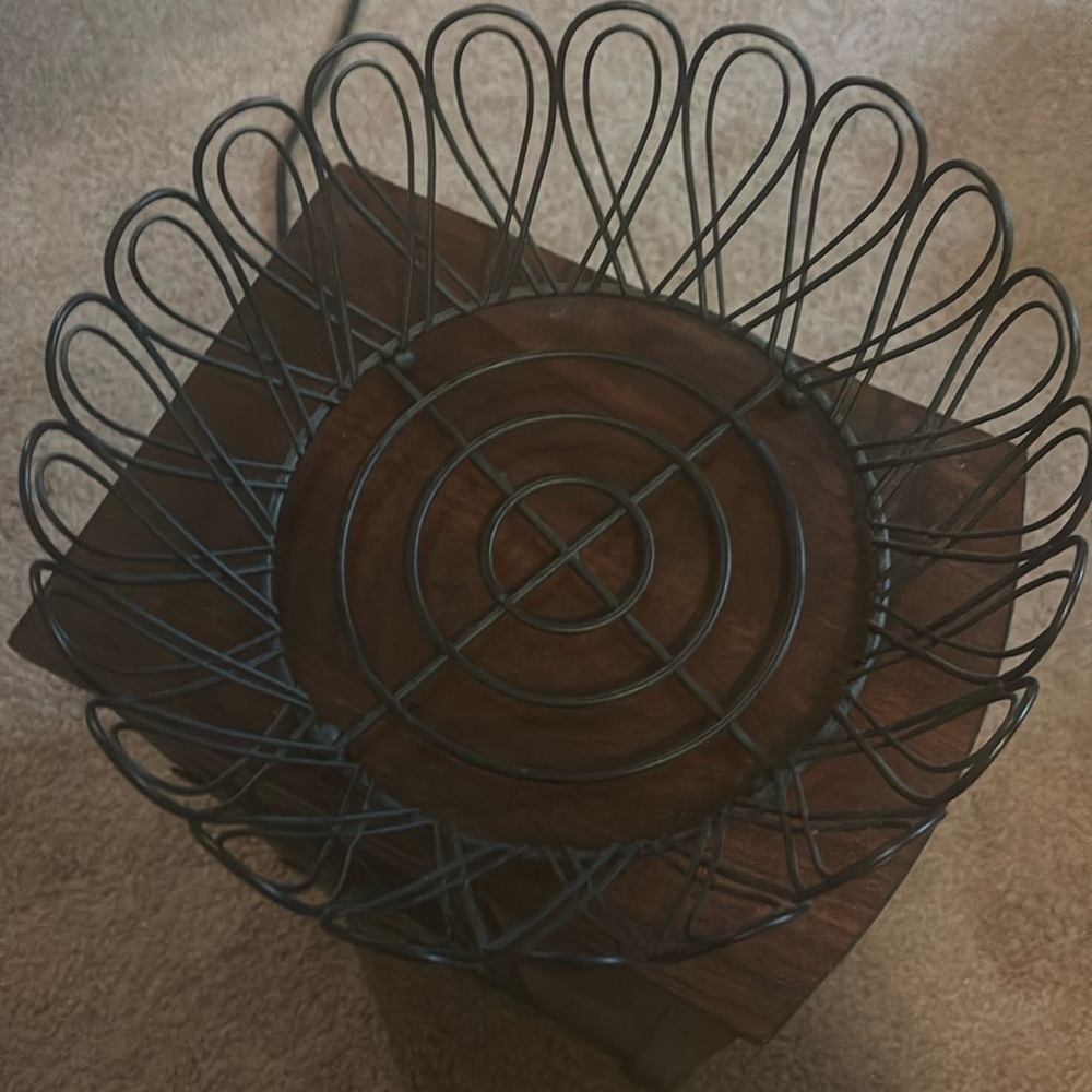 Like new round black bread basket measures approximately 10” by 4” high